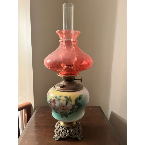  Vintage kerosene oil lamp, characterized by its hand-painted glass base featuring floral motifs, a 