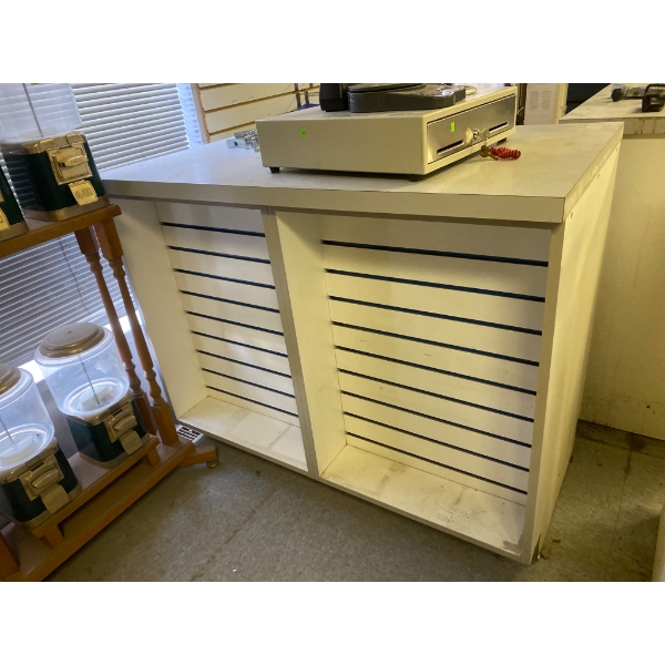 White Retail Counter with Slatwall Front and Storage Shelf