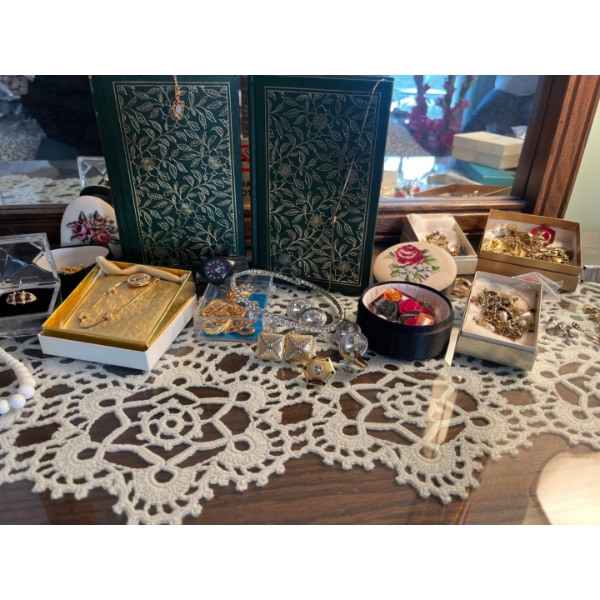 Collection of costume, jewelry and two vintage books. Lots of beaded necklaces all non research.