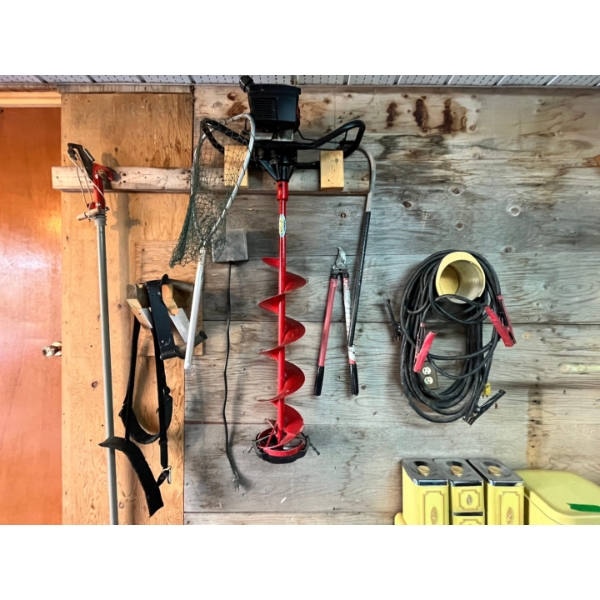 Eskimo ice auger, jumper, cables, fishing net, and tree branch trimmer

