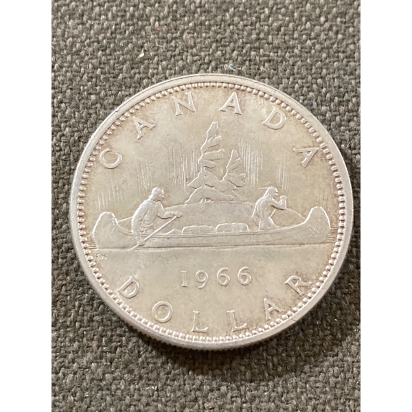 1966 Canadian Silver Dollar Coin Featuring Canoe Design