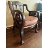 Image 1 : Armchair in an Empire style, crafted from dark wood with scrolled arms and distinctive carved feet