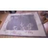 Image 2 : Frosted Glass and Metal Rectangular Table with Floral Area Rug