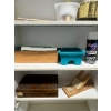 Image 3 : White simple cabinet with art supplies inside. 