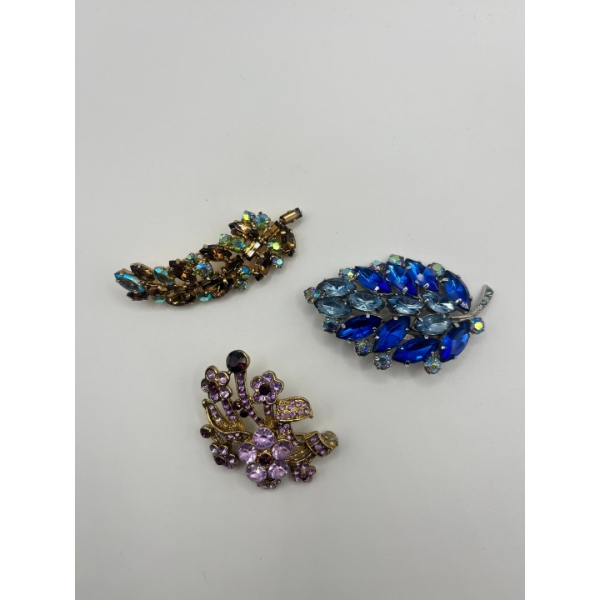 3 Beautifully Elegant Brooches With Their Own Colourful Crystals To Enhance The Vibrant Sparkle.  