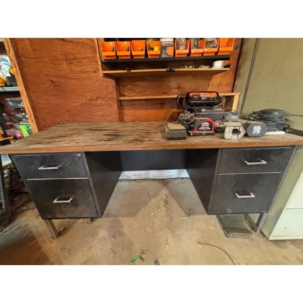 desk with drills, laser level, Mastercraft battery charger and contents in the desk

