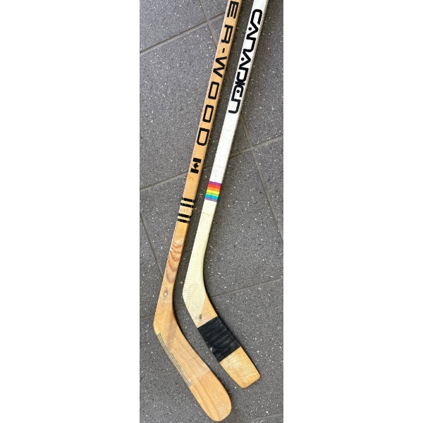 Two Wooden Ice Hockey Sticks by Canadian and Sher-Wood
