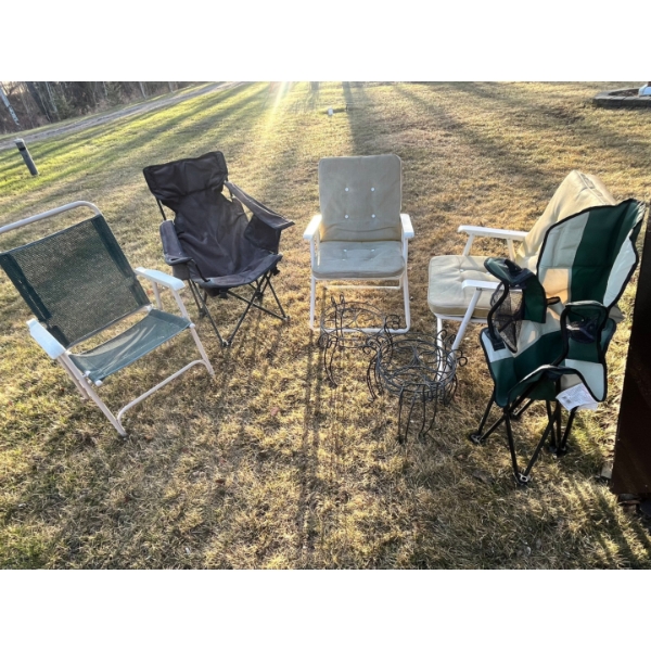 Five lawn chairs with three plant stands. 

