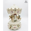Image 1 :  Beautiful Ceramic Carousel Music Box Revolving Horses, Intricate Gold Accents, And Christmas-Themed