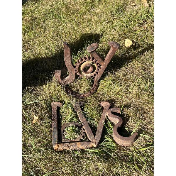 hand crafted love and joy signs  made from railway pins and crafted in Alberta