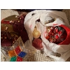 Image 8 : beautiful Christmas lights filled with vintage glass ornaments, small drums poinsettias for the Chri