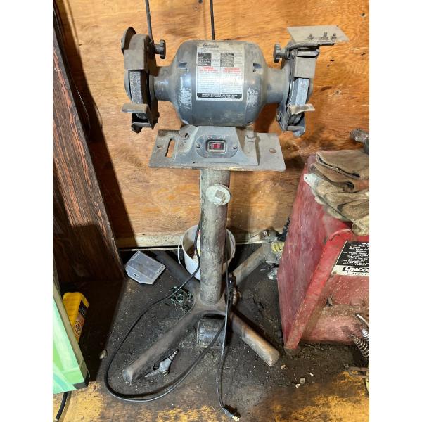 Grinder on pedestal.