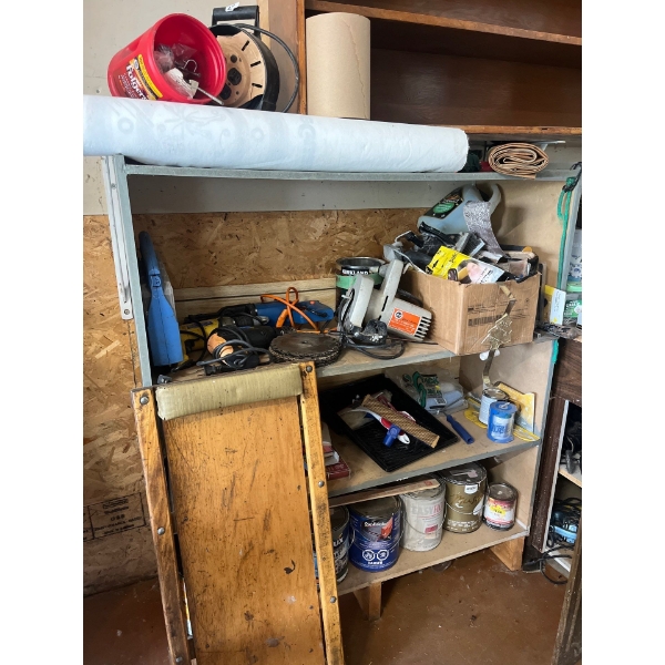 shelf with contents, including saws, cutoff, saws, electric drills, painting supplies, and a number 