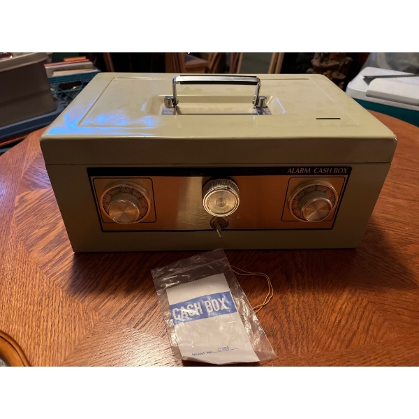 Vintage alarm cash box safe with 10 rolls of un researched pennies