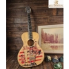 Image 3 : Lot Featuring Acoustic Guitar, Framed Lake Scene Print, Ceramic Figures, and Decorative Mug