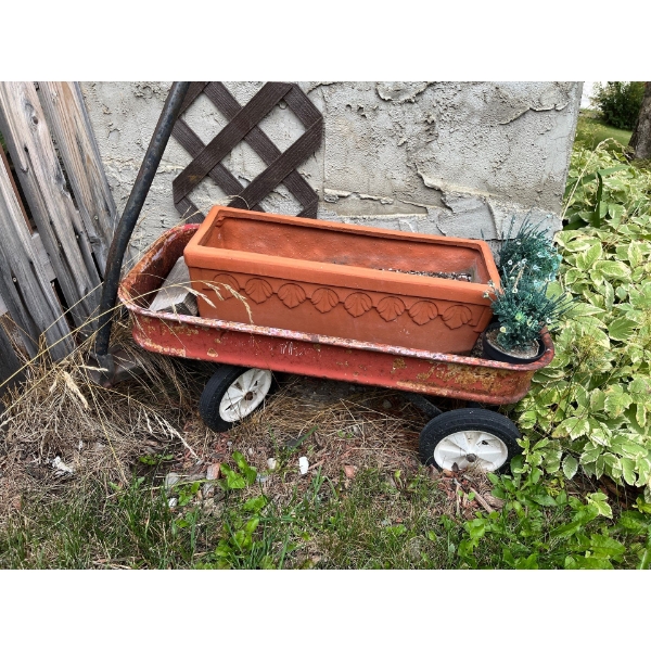 All front yard, lawn, ornaments, saw blades, milk, cans, wagon, wheels, sprinklers, and a birdhouse 