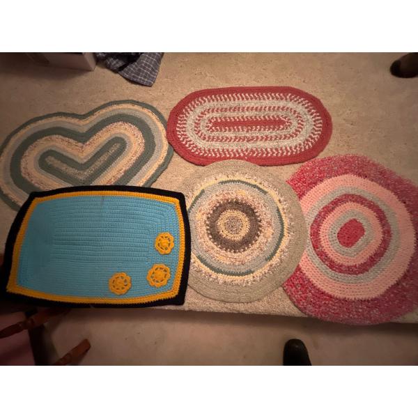 This is a handmade collection of crocheted rag rugs
5 in total .