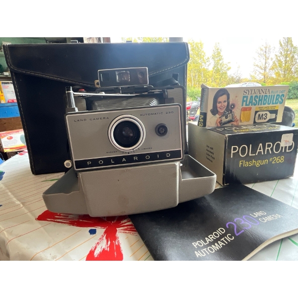  vintage Polaroid 230 land camera automatic with extra flashes and Polaroids .