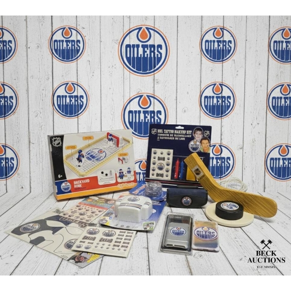  Collection Of Edmonton Oilers Merchandise, Including Various Branded Accessories And A Mini Hockey 