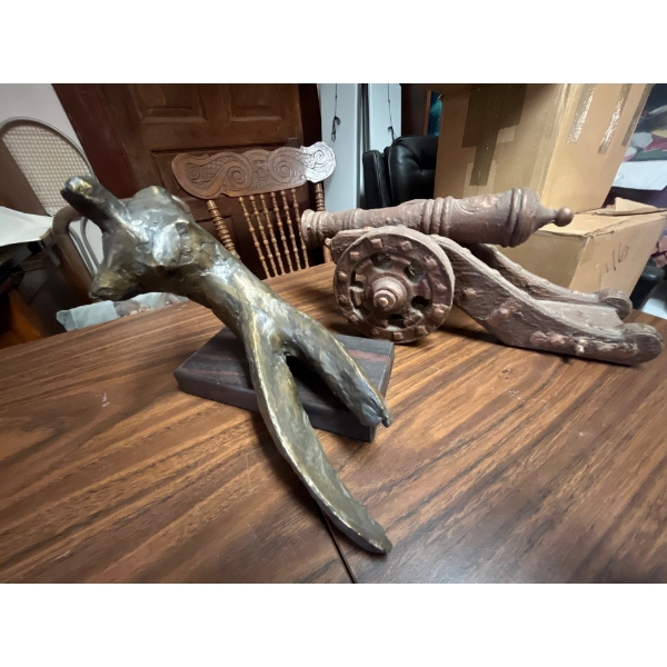 ceramic canon and bronze sculpture