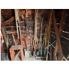 Image 3 : All Yard items on the wall, including pitchforks shovels brooms all sorts of shovels chains 