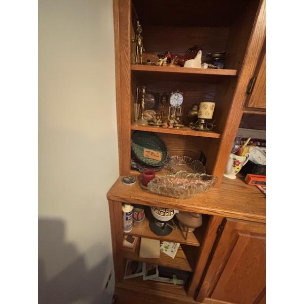 collection of miscellaneous items, including crystal serving trays, a vintage clock, and a bunch of 