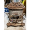Image 1 :  cast-iron woodstove from Burrow Stuart at Melanie COLTD Hamilton Ontario Garnet number 134