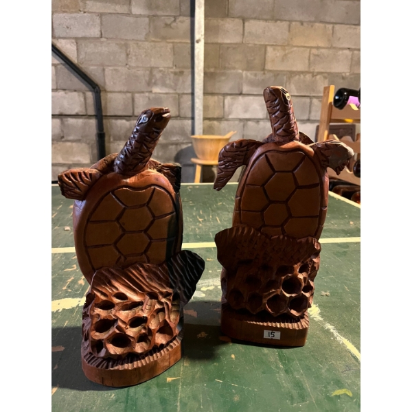 2 wooden turtles that stand 13 inches tall with slight damage on the fins noted in photos