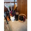 Image 1 : variety of umbrellas, sandals, and a pair of black boots, including basket and ceramic umbrella hold