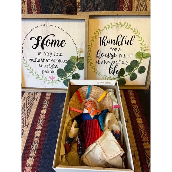 2 inspirational quotes wall hangings and a string puppet