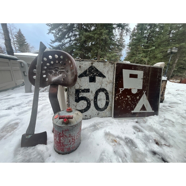 antique tractor seat with antique gas can axe and two road signs 50 and up and camping great for any