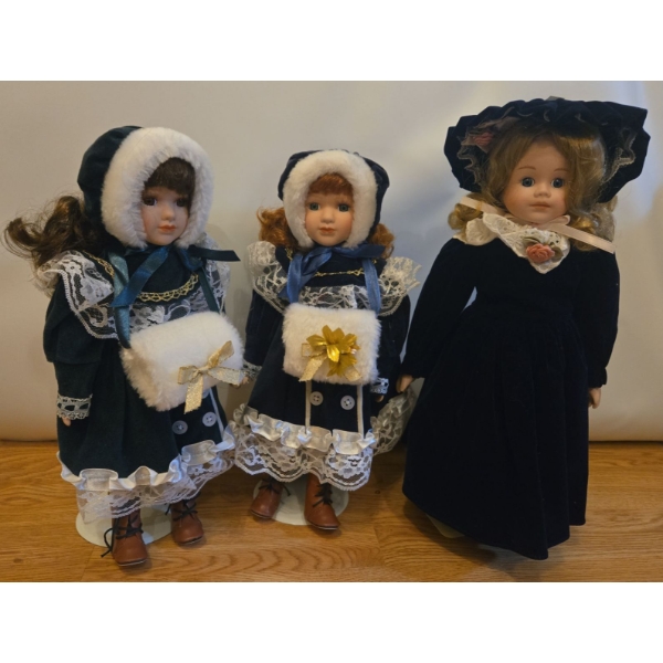Porcelain Dolls: Sister Carolers. Tallest is 14T 