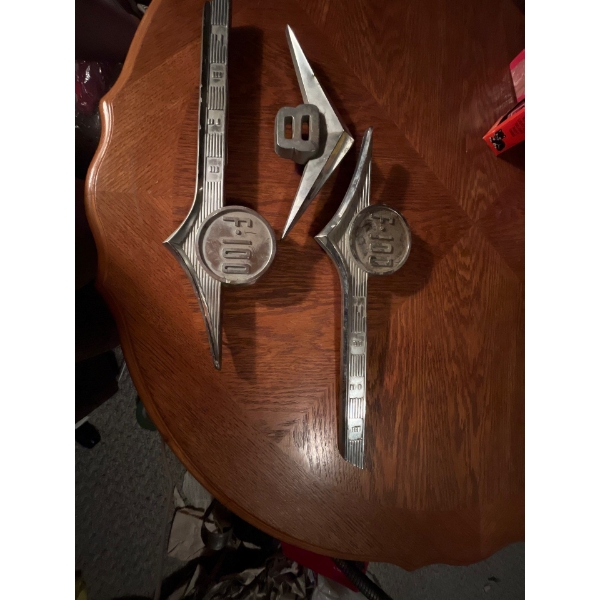 Ford 100 emblems and a V8 emblem in great shape