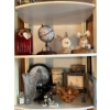 Image 1 : Shelf with contents with small collectibles .