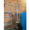 Image 4 : pegboard with various tools, including bolt cutters gear, polars, hacksaw, bungee cords, vice grips,