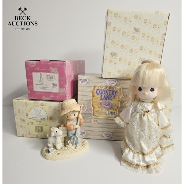  several Precious Moments figurines and a doll, 