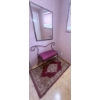 Image 1 : Metal-Framed Bench with Upholstered Seat, Mirror, and Area Rug