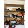 Image 2 :  shelf with contents, including a vintage radio, moving sliders, bolt bins, electric power tools, in