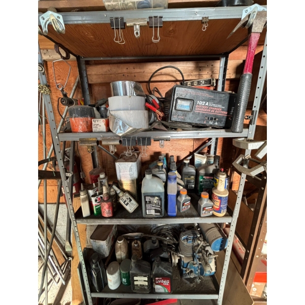 entire shelf full of goodies battery charger antique motor lubricant tape filter filters hammer saw 