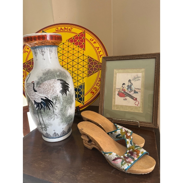 Collection of cool items, including a handmade pair of wooden shoes with hand beads done on them Chi