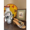 Image 1 : Collection of cool items, including a handmade pair of wooden shoes with hand beads done on them Chi
