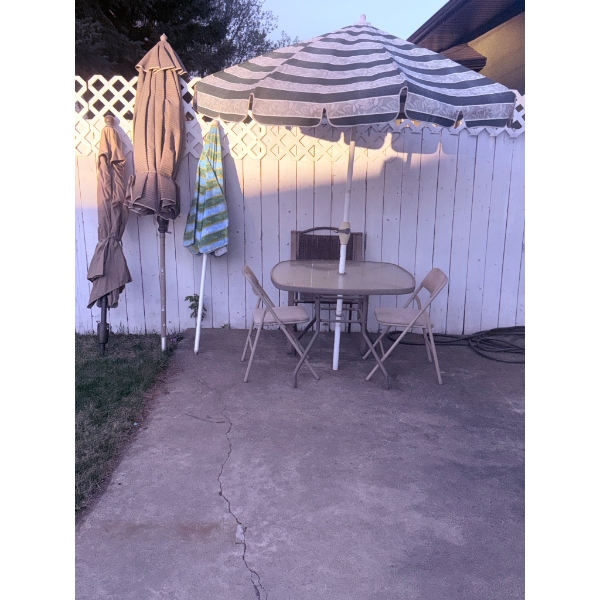 Outdoor Patio Set with Umbrella, Glass Table, and Folding Chairs