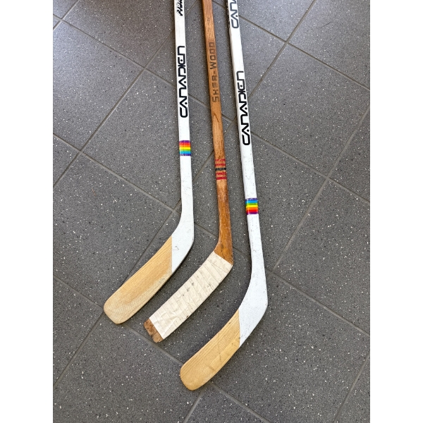 Three Hockey Sticks Including Canadien and Sher-Wood