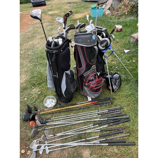 Large collection of golf clubs, ping Taylor made and a number of antique wooden clubs as well a numb