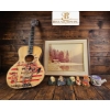 Image 1 : Lot Featuring Acoustic Guitar, Framed Lake Scene Print, Ceramic Figures, and Decorative Mug