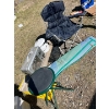 Image 1 : Camping chair, small stool woven RV mat, enamel pot and a Berkeley heater. 

