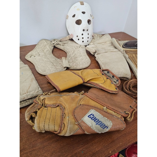 Vintage Collection of Hockey Equipment Including Mask, Pads, Skates, and Gloves