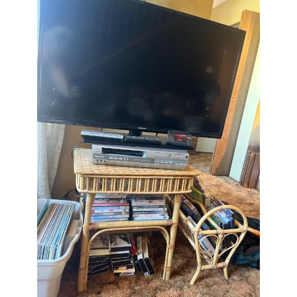 Samsung  40" TV With Panasonic VHS & DVD Player  With Assorted VHS & DVD's On Wicker Table 
