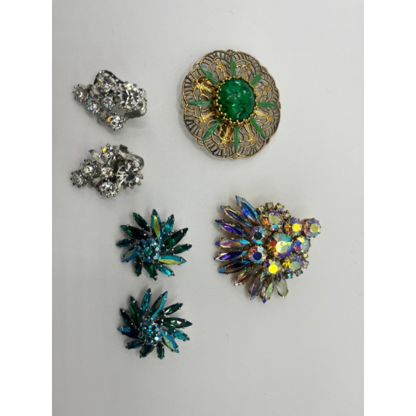 Vintage West Germany Gold Tone Brooch Featuring A Central Green Peking Glass Cabochon. a vintage bro