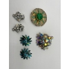 Image 1 : Vintage West Germany Gold Tone Brooch Featuring A Central Green Peking Glass Cabochon. a vintage bro